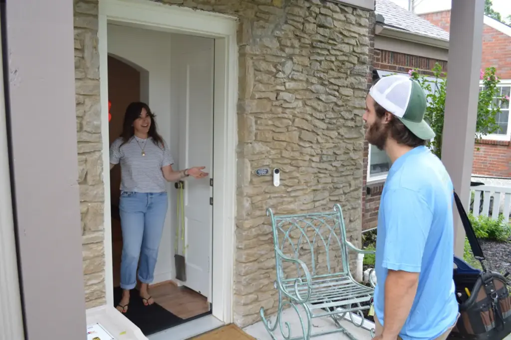 Technician meets customer at door