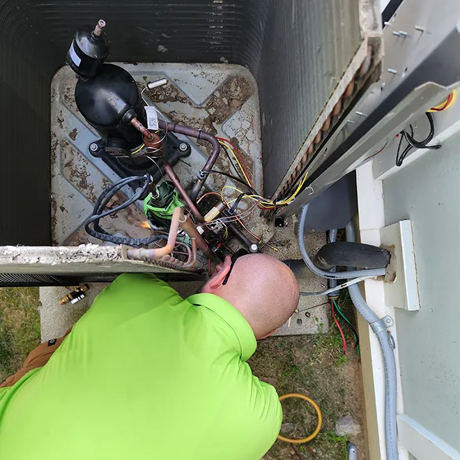 Cumberland Cooling technician repaining HVAC