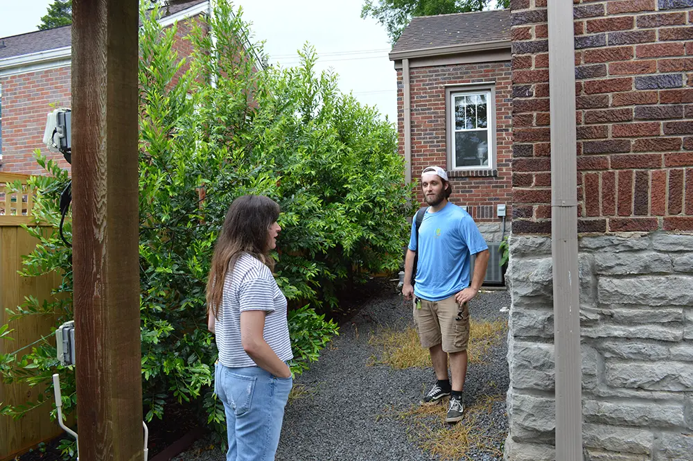 Cumberland Cooling technician with customer at home