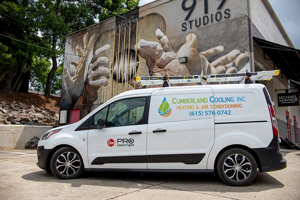 Cumberland Cooling van parked in front of mural on art studio