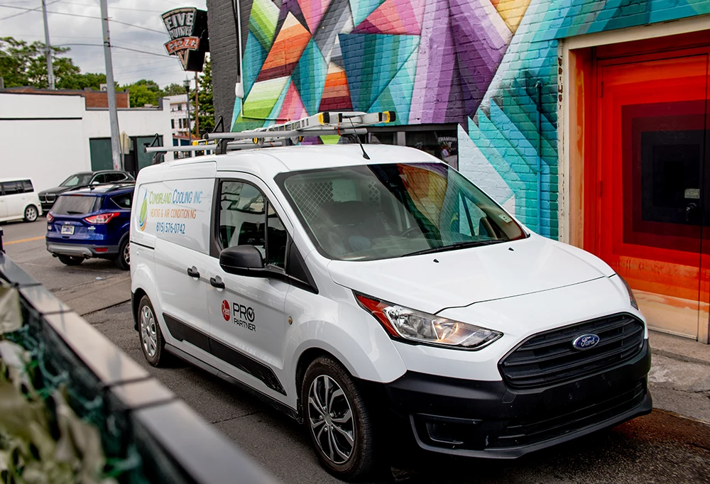 Cumberland Cooling van in front of mural next to Five Points Pizza
