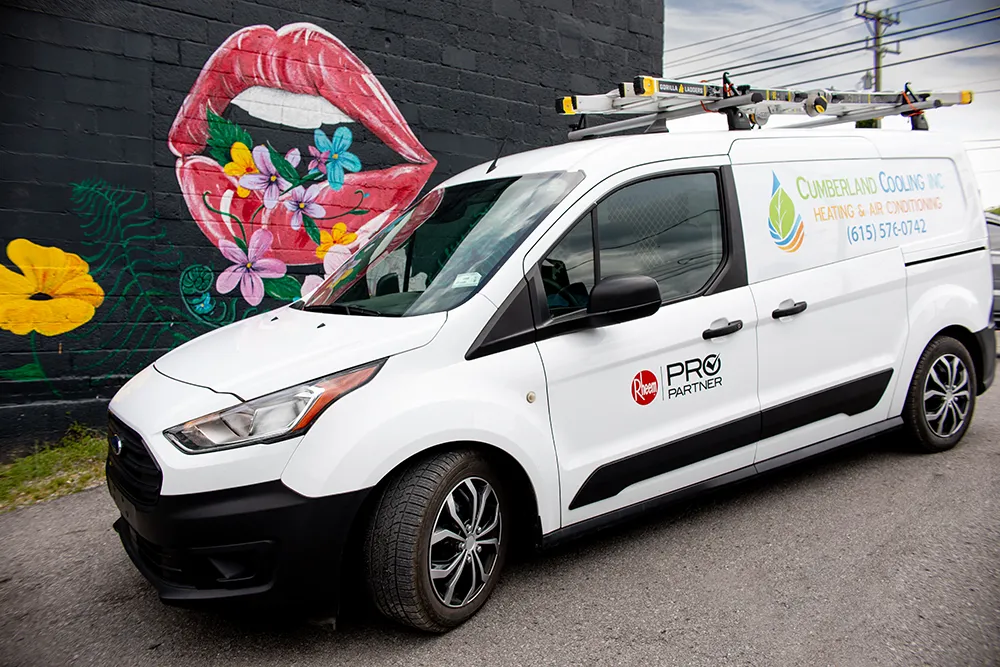 Cumberland Cooking Van parked in front of East Nashville mural with flowers over red lips