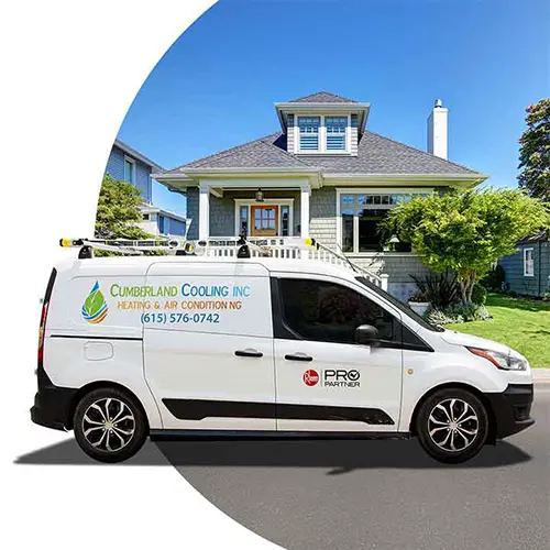 Cumberland Cooling van parked outside of a house