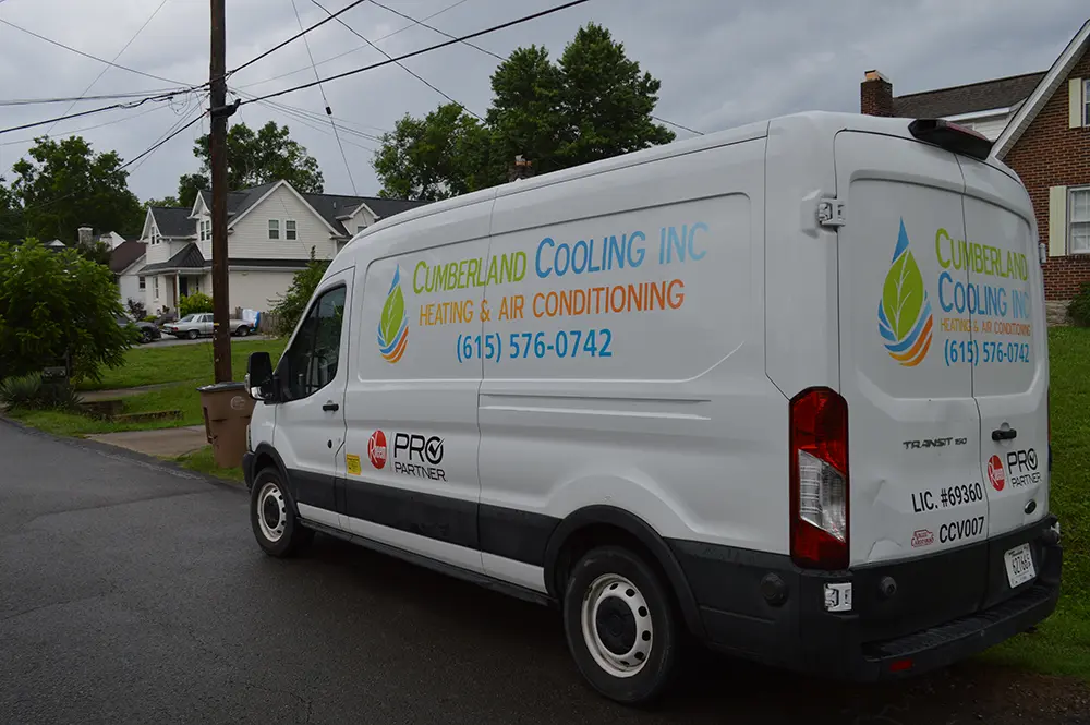 Cumberland Cooling van parked outside house
