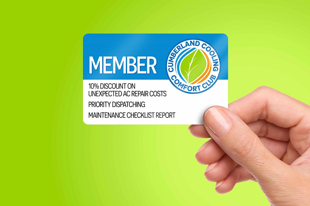 Hand holding Cumberland Cooling Comfort Club membership card
