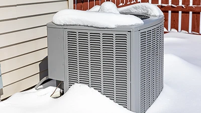 HVAC in winter with snow on it