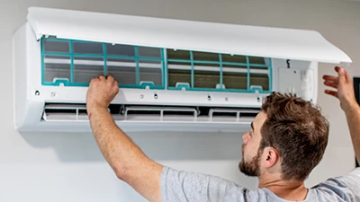 Cumberland Cooling employee installs a ductless mini split